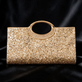 Sac à main doré pailleté